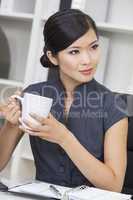 Chinese Asian Woman Businesswoman Drinking Tea or Coffee
