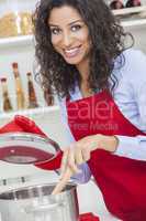 Happy Woman Cooking in Kitchen
