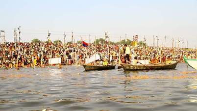 Pan shot boats in a river during Kumbh Mela