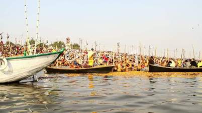 Pan shot boats in a river during Kumbh Mela