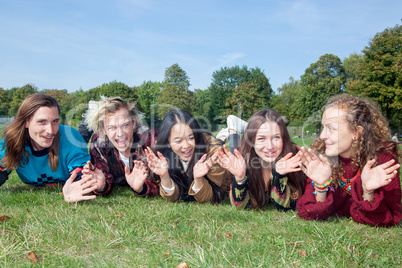 Group of young people lying in the park