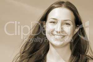 Portrait of a young woman with long brown hair