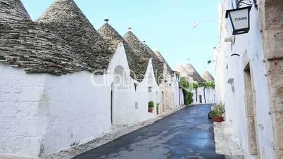 Pan shot of Trulli houses in a town