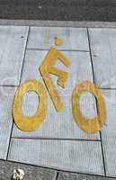 Bicycle sign path on the pavement