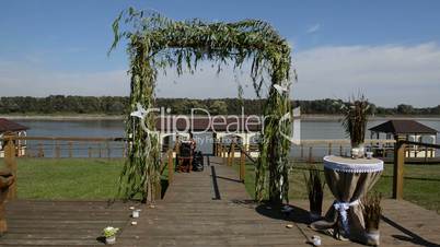 The wedding arc decorated with white butterflys which move from the wind