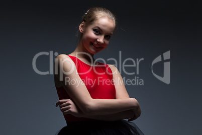 Smiling girl with arms crossed