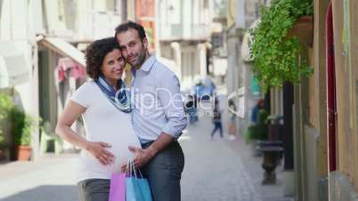 4of7 Happy people, husband, wife, man with pregnant woman shopping