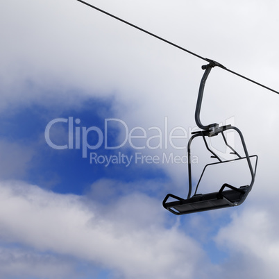 Chair-lift and cloudy sky