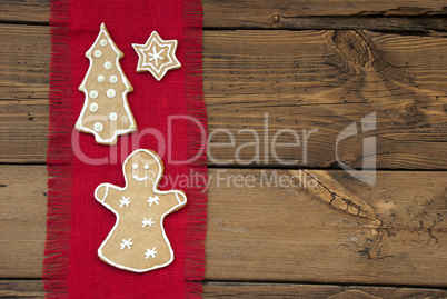 Ginger Bread on Red and Wooden Background