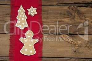Ginger Bread on Red and Wooden Background