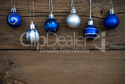 Blue and Silver Christmas Tree Balls on Wood