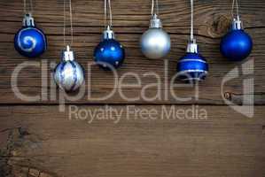 Blue and Silver Christmas Tree Balls on Wood