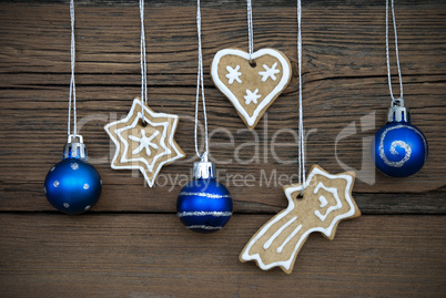 Ginger Bread Cookies and Christmas Balls on Wood