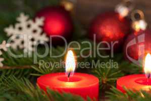 Closeup of a Candle with Christmas Decoration