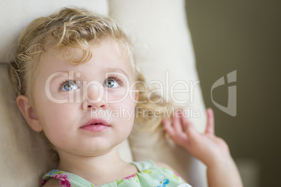 Adorable Blonde Haired and Blue Eyed Little Girl in Chair