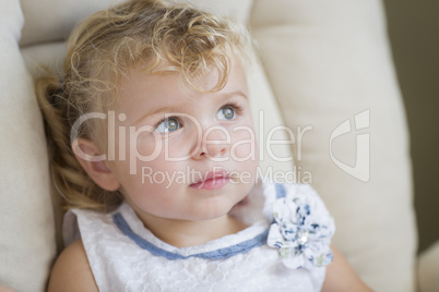 Adorable Blonde Haired and Blue Eyed Little Girl in Chair