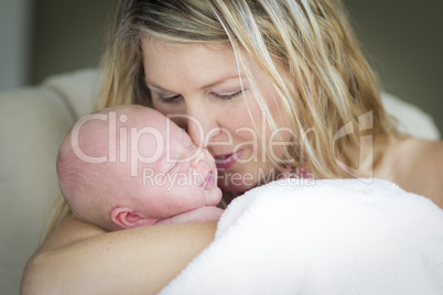 Young Beautiful Mother Holding Her Precious Newborn Baby Girl