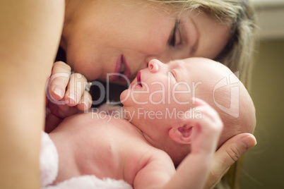 Young Beautiful Mother Holding Her Precious Newborn Baby Girl