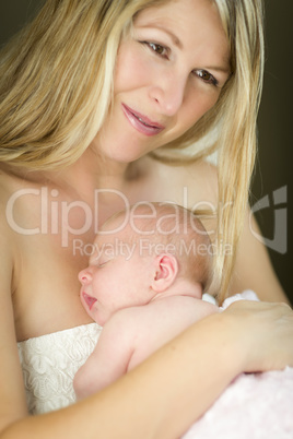 Young Beautiful Mother Holding Her Precious Newborn Baby Girl