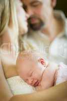 Beautiful Young Couple Holding Their Newborn Baby Girl