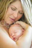 Young Beautiful Mother Holding Her Precious Newborn Baby Girl