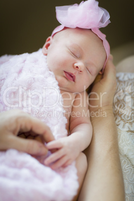 Hands of Mother Holding Her Newborn Baby Girl