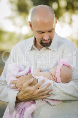 Young Handsome Father Holds His Newborn Baby Girl