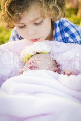 Young Boy Gazing at His Newborn Baby Girl Sister