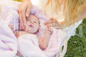 Hands of Mother Caressing Her Newborn Baby Girl