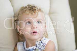 Adorable Blonde Haired and Blue Eyed Little Girl in Chair