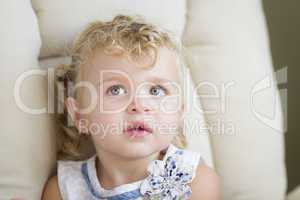 Adorable Blonde Haired and Blue Eyed Little Girl in Chair