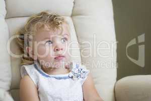 Adorable Blonde Haired and Blue Eyed Little Girl in Chair