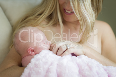 Young Beautiful Mother Holding Her Precious Newborn Baby Girl