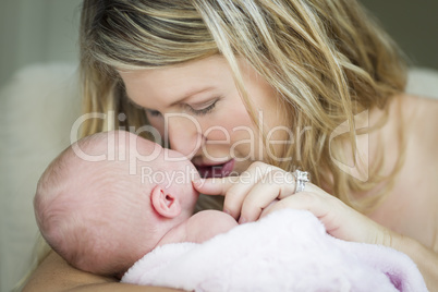 Young Beautiful Mother Holding Her Precious Newborn Baby Girl