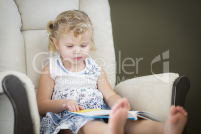 Blonde Haired Blue Eyed Little Girl Reading Her Book