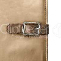 notebook closeup with buckle in the form of a leather strap