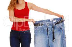 Woman holding big pants.