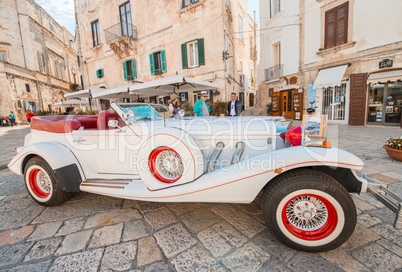 POLIGNANO AL MARE, ITALY - AUGUST 28, 2014: Tourists enjoy old c