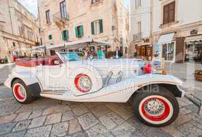 POLIGNANO AL MARE, ITALY - AUGUST 28, 2014: Tourists enjoy old c