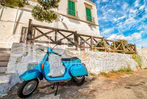 POLIGNANO AL MARE, ITALY - AUG 28: Blue vintage Vespa in old str