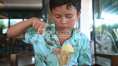 Child eating ice cream at the restaurant
