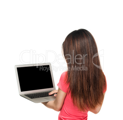 Asian girl standing with laptop. Back view, isolated on white