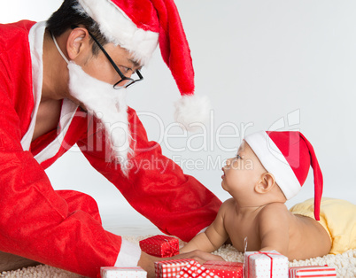 Asian santa claus with baby