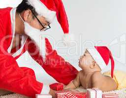 Asian santa claus with baby