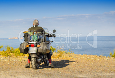 Motorbike standing on shore