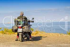Motorbike standing on shore