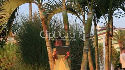 Boy using digital tablet outdoor
