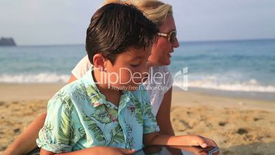 Mother and son with digital tablet