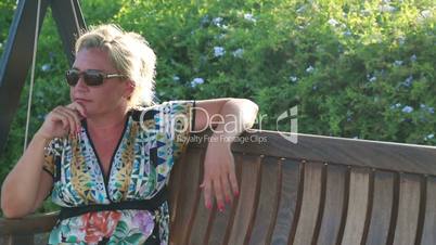 lonely sad woman on swing