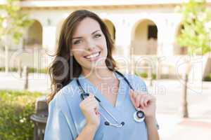 Proud Young Adult Woman Doctor or Nurse Portrait Outside